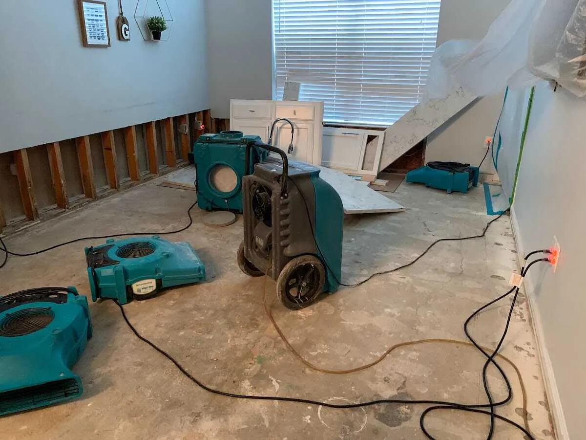 Dehumidifier in flood-cut room for Water Damage Restoration in Booneville